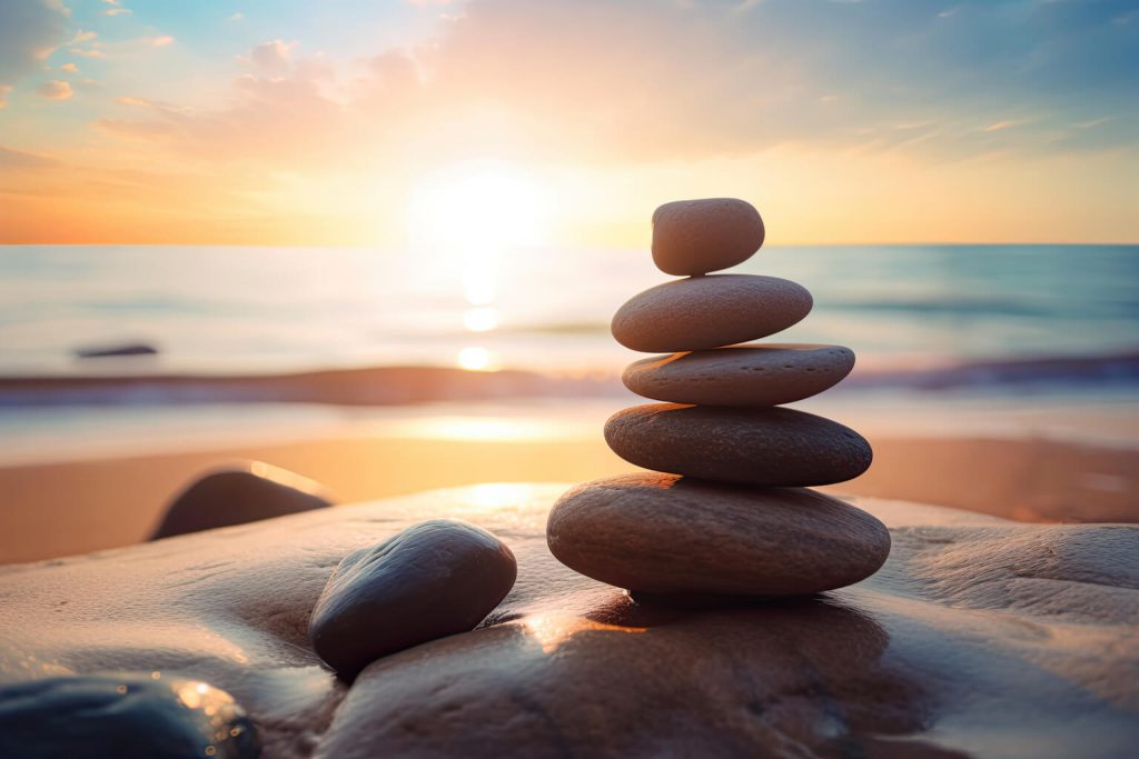 zen-stones-balanced-beach-with-co